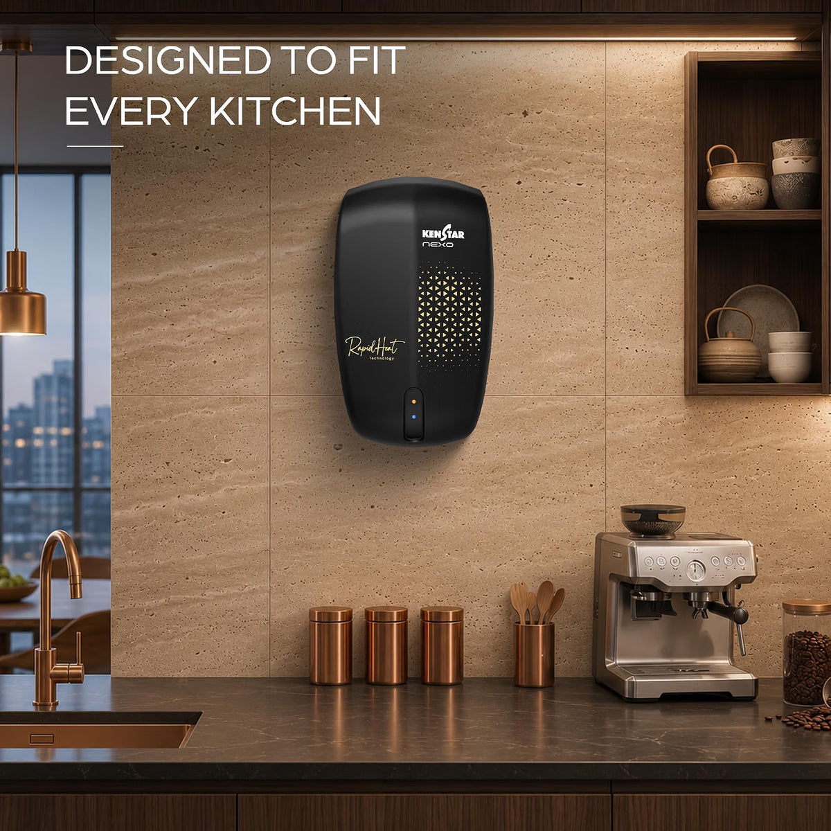 A wall-mounted black KenStar Radiant paper towel dispenser installed in a modern kitchen setting with a stone tile backsplash, coffee machine, and copper canisters on the counter.