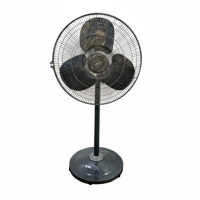 Black standing fan on a tiled floor with a white wall background