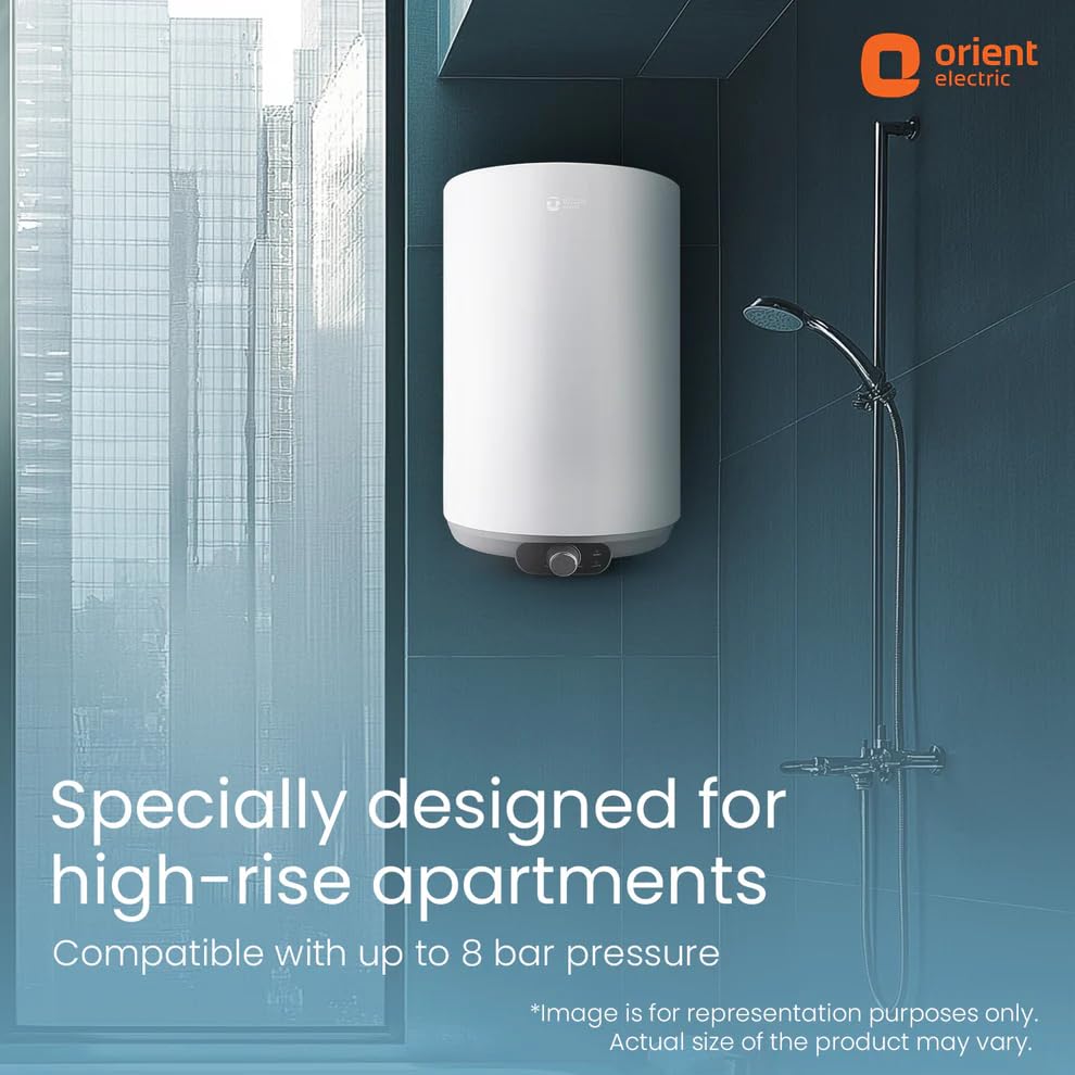 A white cylindrical water heater mounted on a blue-gray tiled wall in a bathroom setting, with a shower fixture to the right and promotional text at the bottom. The Orient Electric logo appears in the top right corner.