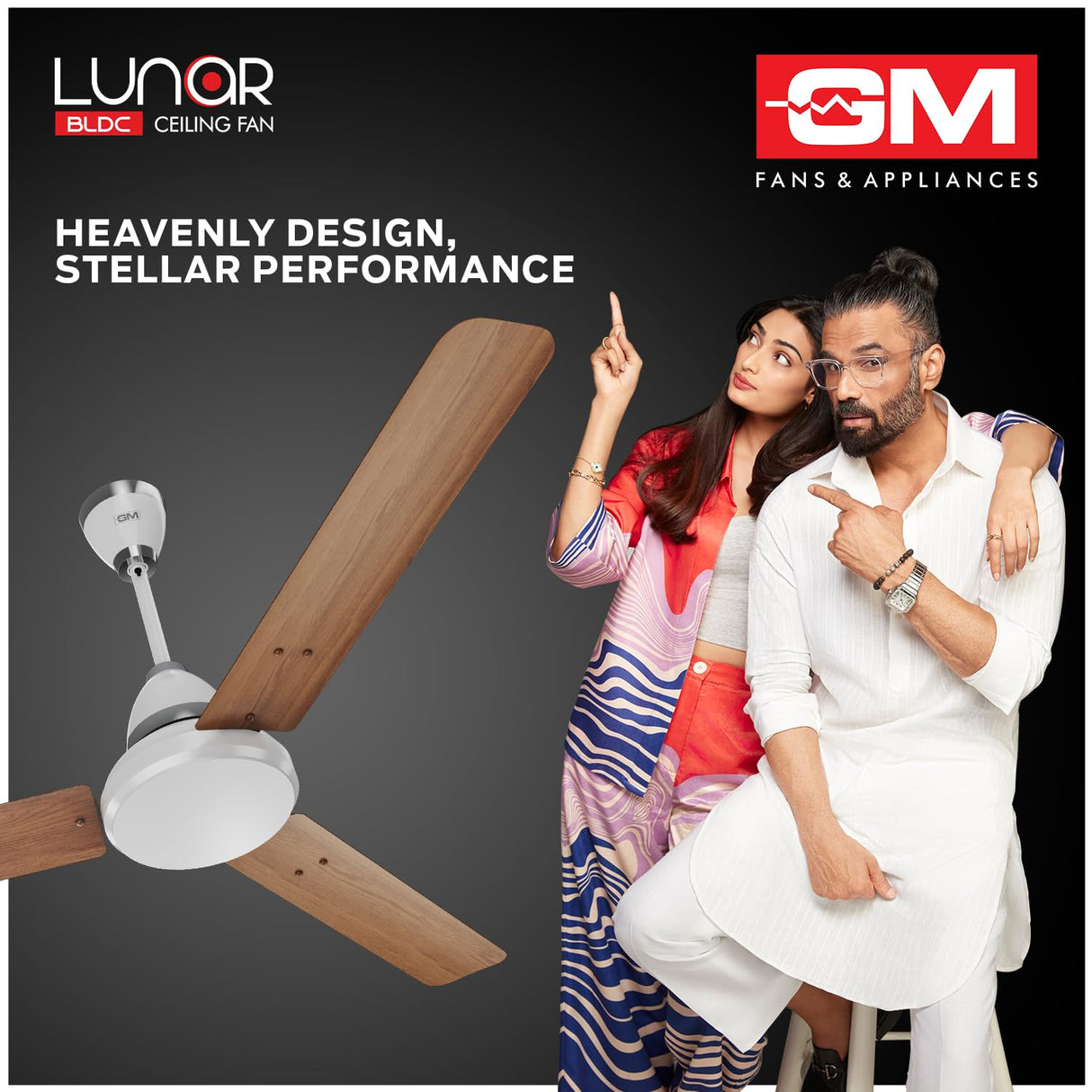 Advertisement for Lunar BLDC ceiling fan with a couple pointing at it, featuring GM Fans & Appliances logo.