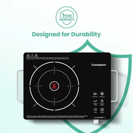 Crompton brand induction cooktop with warranty badge on a light green background