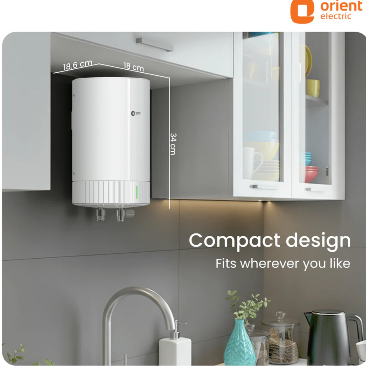 White water heater mounted on a kitchen wall with 'Orient Electric' branding.