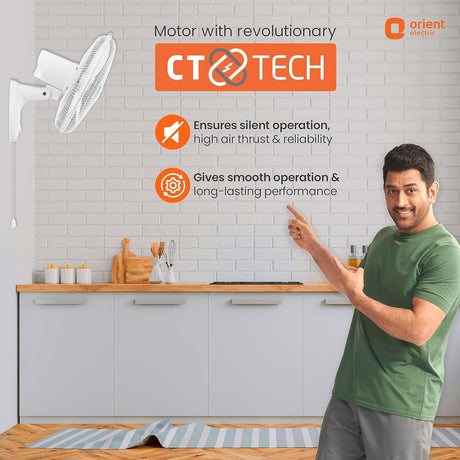 Person in a kitchen pointing at a ceiling fan with 'Orient Electric' branding and CT Tech features.
