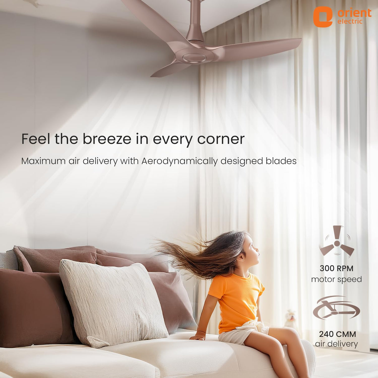 Ceiling fan in a room with a child sitting on a couch, promoting maximum air delivery.
