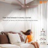Ceiling fan in a room with a child sitting on a couch, promoting maximum air delivery.