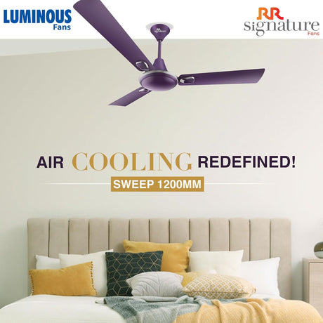Purple ceiling fan above a bed with 'Luminous Fans' and 'RR Signature Fans' branding.