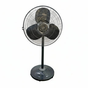Black standing fan on a tiled floor with a white wall background