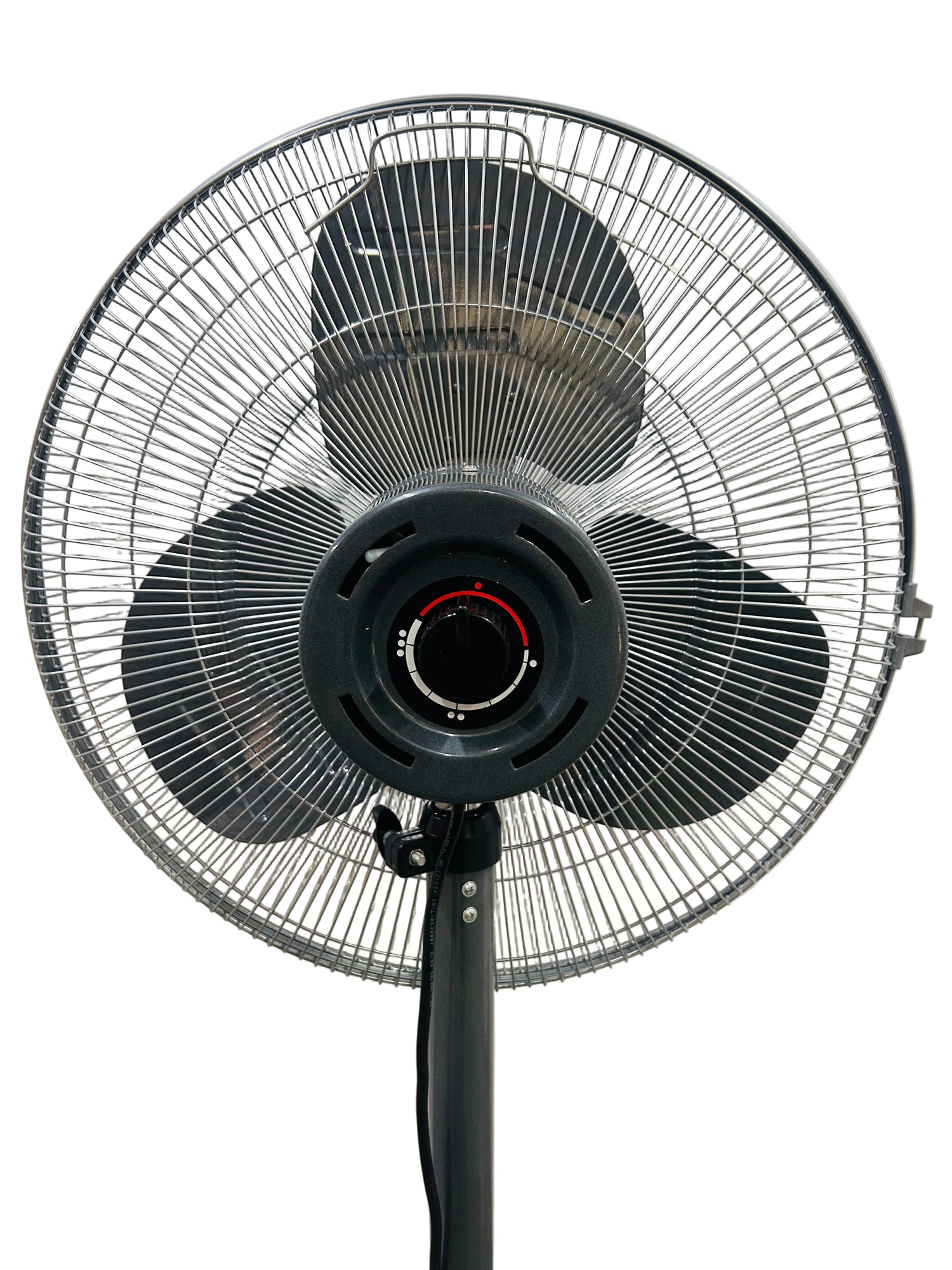 Black standing fan against a white wall