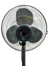 Black standing fan against a white wall