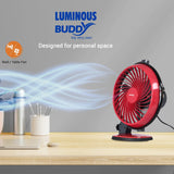 Red fan on a desk with Luminous Buddy branding and product description.