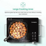 Crompton electric stove with a frying pan on it, displaying food cooking.