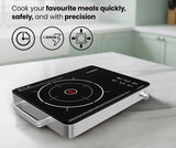 Induction cooktop on a kitchen counter with text highlighting features