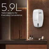 A KenStar wall-mounted dispenser shown installed on a brown stone wall in a bathroom setting, with large text on the left reading '5.9L Tank Capacity for Everyday Convenience'.