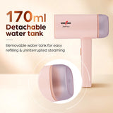 Pink handheld steam cleaner with a detachable water tank, shown on a warm beige background with promotional text reading '170ml Detachable water tank' and a circular inset highlighting the tank.