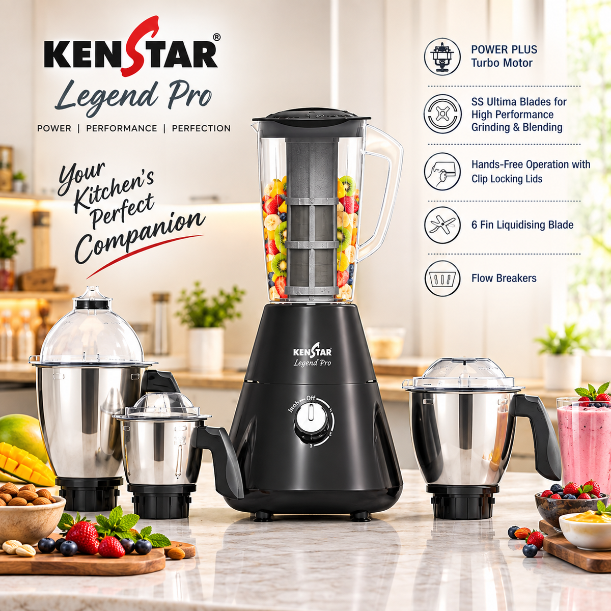 KenStar Legend Pro blender set displayed on a kitchen countertop with a blurred kitchen background. The set includes a black main blender base with a clear pitcher filled with fruit, a smaller black and silver chopper attachment, a second silver jar, and a small jar with lid.