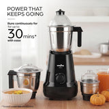 A Kenstar blender shown in a kitchen-like setting with promotional text reading 'POWER THAT KEEPS GOING' and 'Runs continuously for up to 30 mins* with ease.' The main product is a black Kenstar blender with a clear lid and stainless steel jar, surrounded by smaller blender jars, a bowl of soup, pumpkins, and an orange drink.