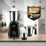 Kenstar Sahyan Pro electric blender shown with its three jars on a wooden countertop, with a blurred kitchen background and a gold and black warranty badge overlay on the right.