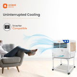 Orient Electric air cooler with person relaxing on a chair, emphasizing uninterrupted cooling.