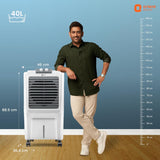 Man standing next to a portable air cooler with dimensions indicated on a blue background
