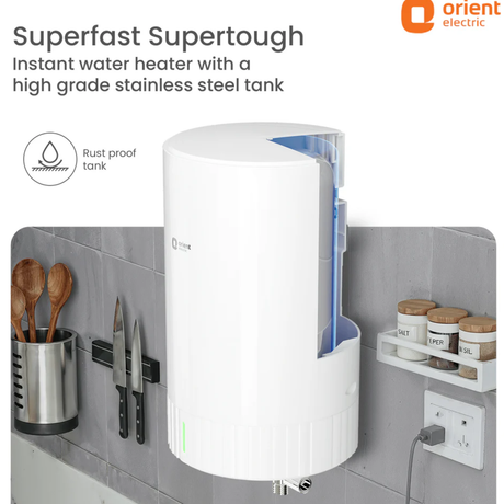 Wall-mounted water heater with kitchen utensils and containers in the background, featuring Orient Electric branding.