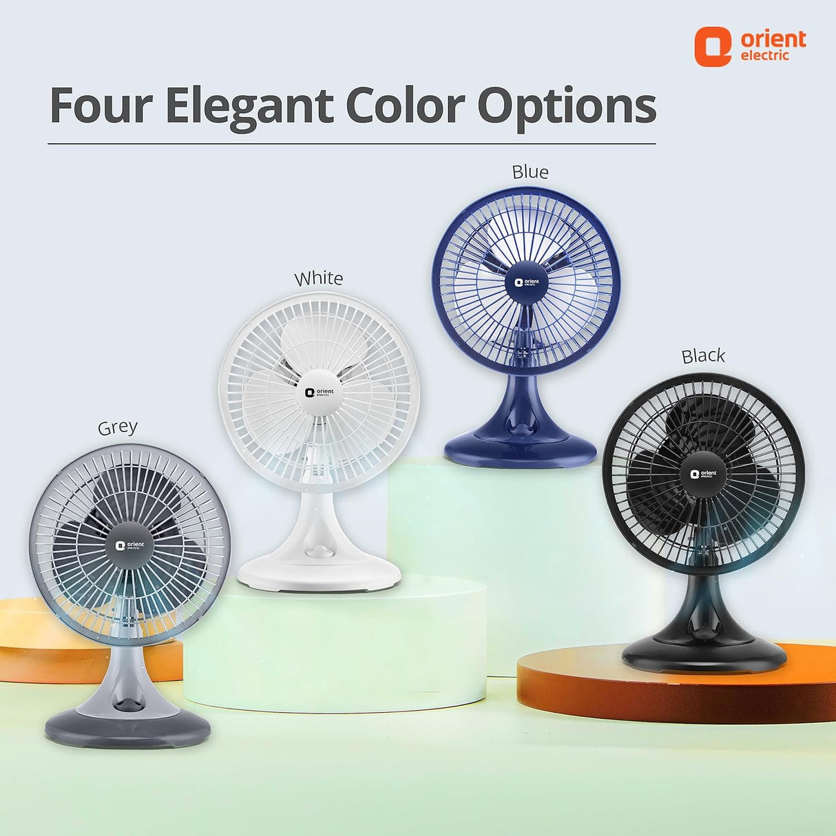 Four fans in different colors (Blue, Black, White, Grey) with 'Orient Electric' branding on a light background.