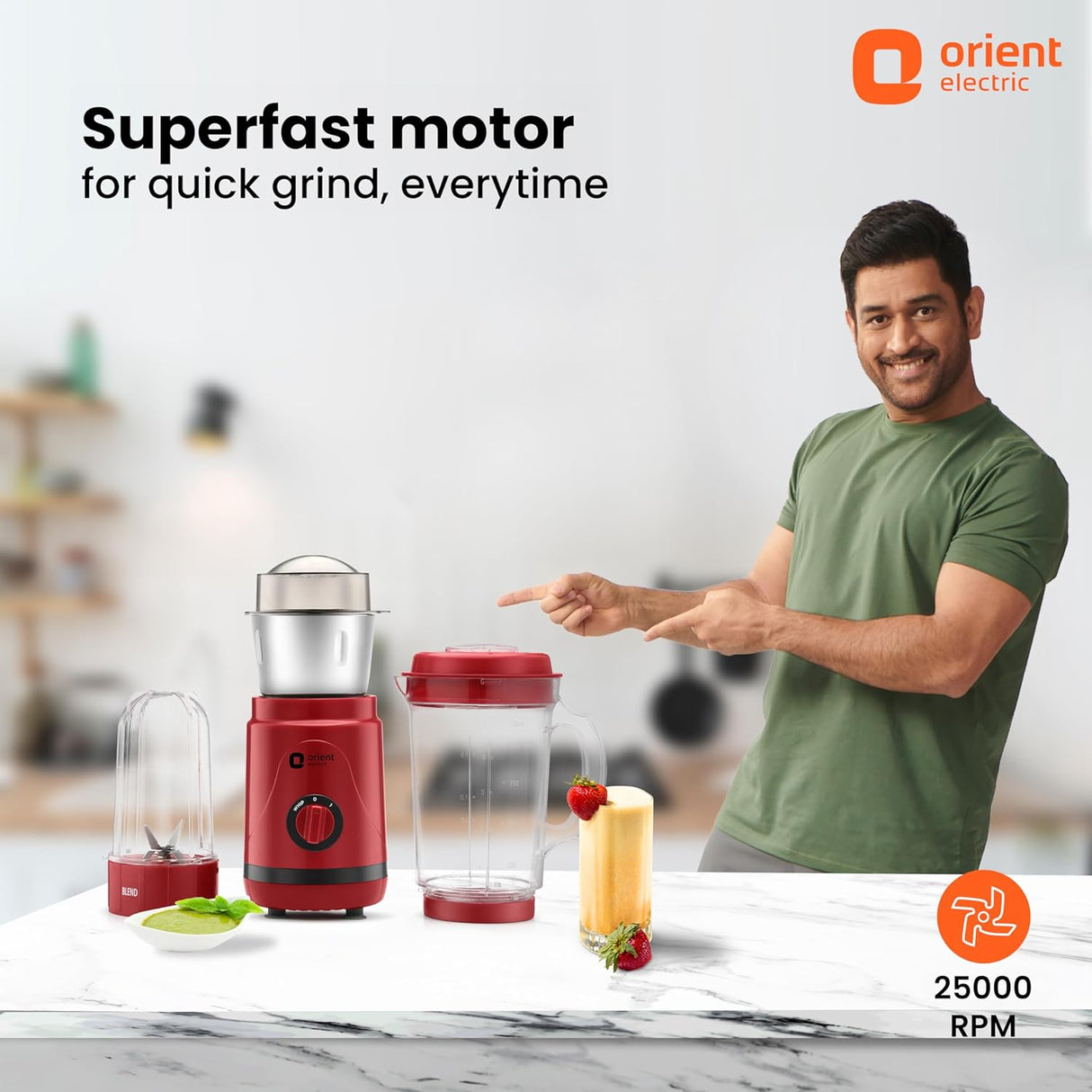 Person pointing at a red blender with 'Orient Electric' branding and text about superfast motor.