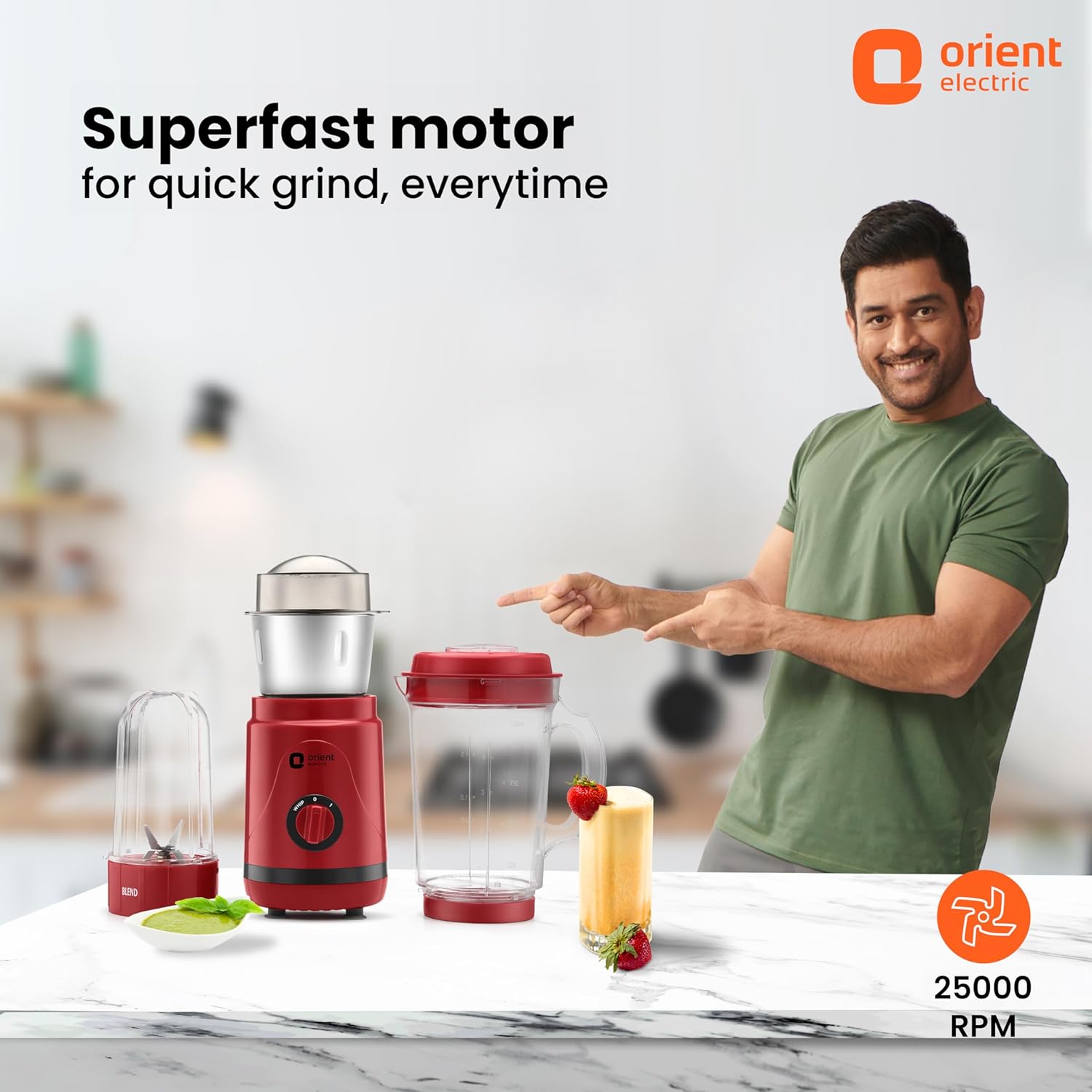 Person pointing at a red blender with 'Orient Electric' branding and text about superfast motor.