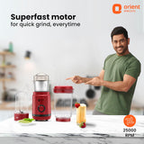 Person pointing at a red blender with 'Orient Electric' branding and text about superfast motor.