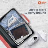 Open suitcase with travel items and 'Orient Electric' branding on a light gray background