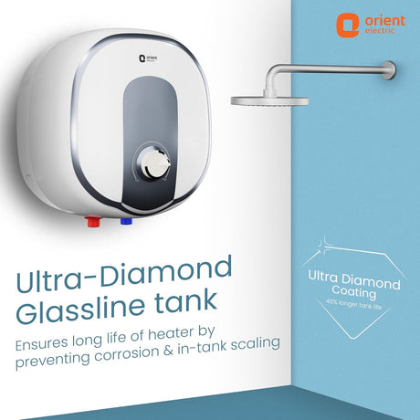 Orient Electric ultra-diamond glassline tank water heater shown mounted on a white wall in a bathroom setting, with a shower head above and promotional text highlighting corrosion prevention and tank longevity.