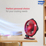 Red portable fan on a table with 'Luminous Buddy' branding and text about personal choice for cooling needs.