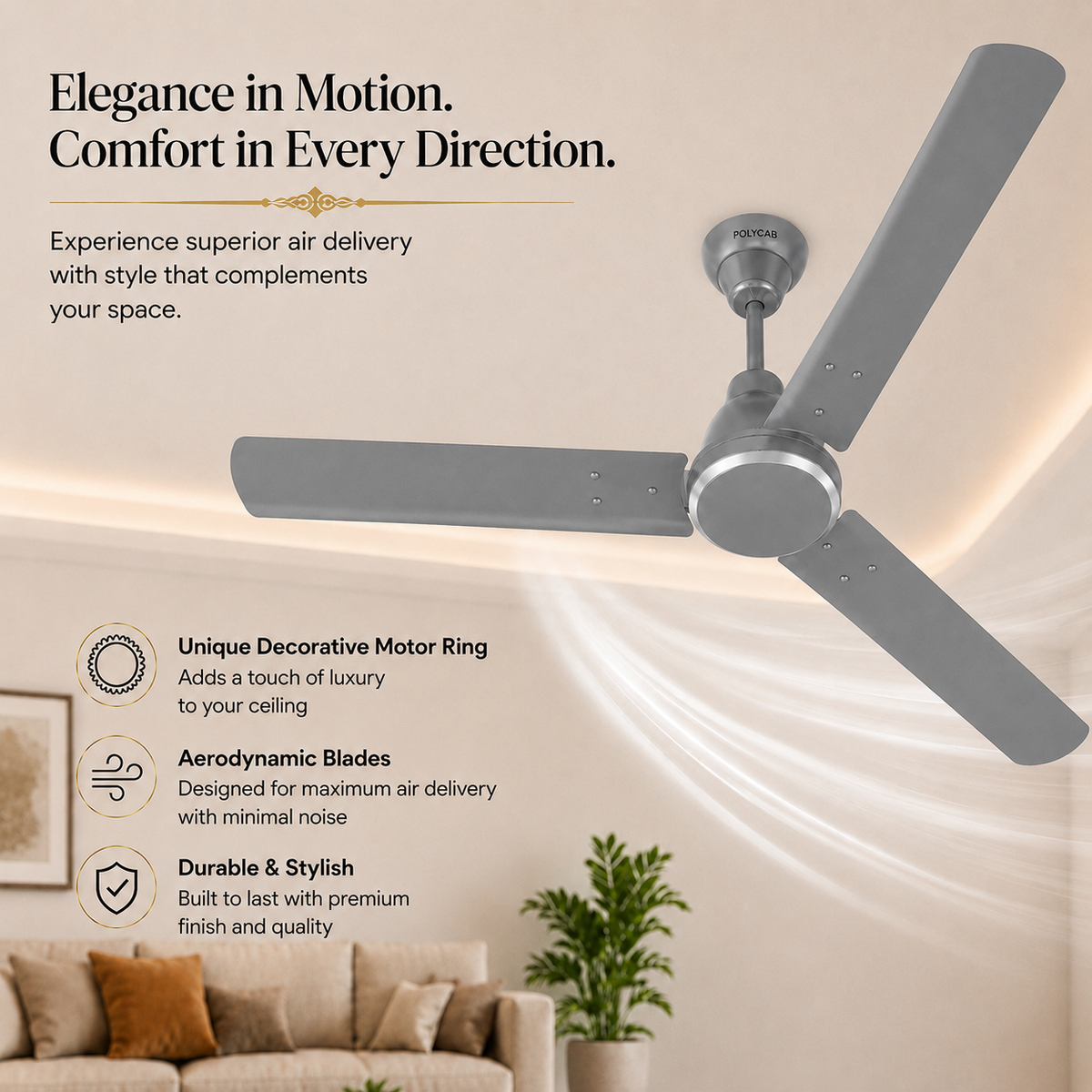 A modern three-blade ceiling fan in a matte gray finish, shown installed on a beige ceiling in a styled living room. The image includes marketing text and feature callouts highlighting the decorative motor ring, aerodynamic blades, and durable finish.