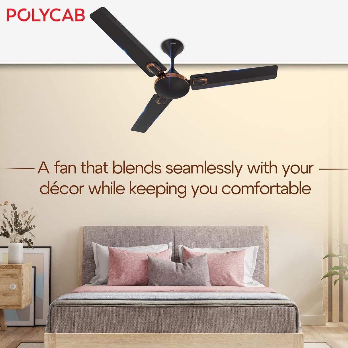 Ceiling fan above a bed in a bedroom with Polycab branding.