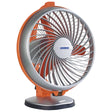 A royal orange personal table fan with a circular guard and a stabilized base, featuring the brand name 'Luminous' on the center.