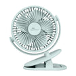 Light blue clip fan on a white background