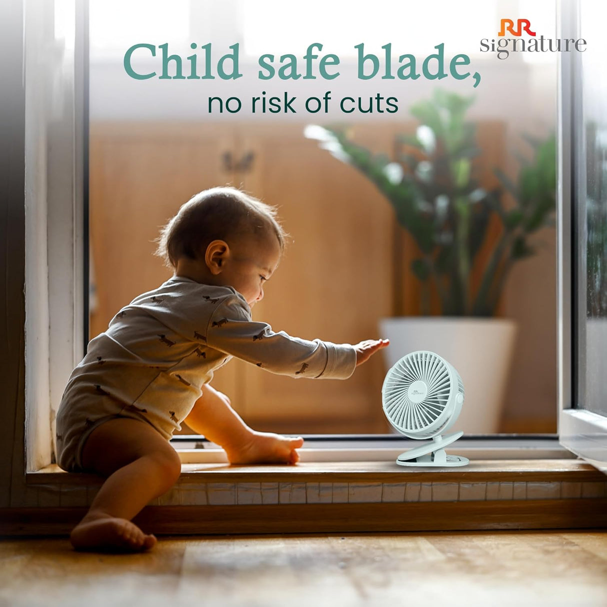Child playing with a small fan on a windowsill, with text about child-safe blades.