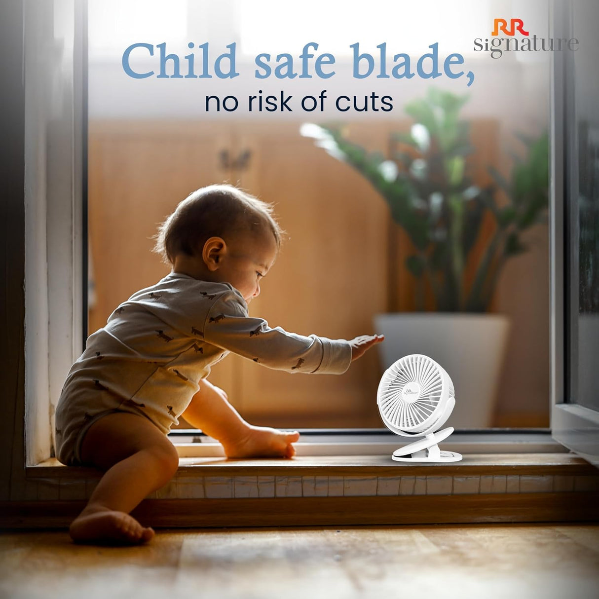 Baby reaching for a small fan on a windowsill with text about child-safe blades.