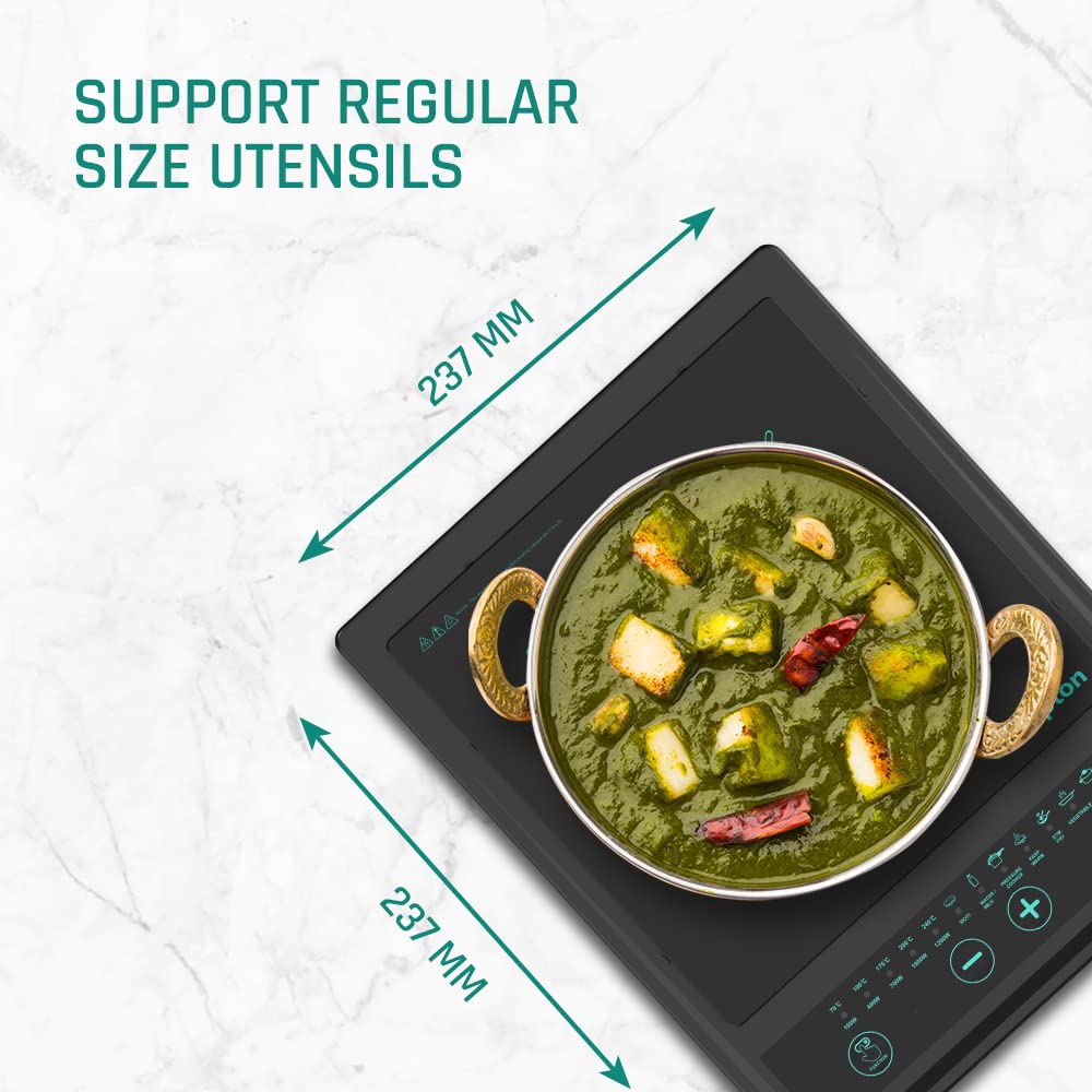 Induction cooktop with a pot of green curry and measurement details on a white background
