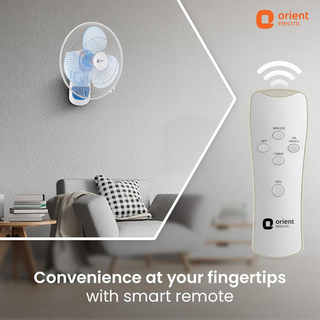 Wall-mounted fan and remote control with Orient Electric branding in a living room setting.