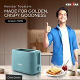 A Kenstar Toasters toaster in olive green is shown on a kitchen counter next to toast and a jar of jam, with a smiling man in a blue shirt giving a thumbs-up in the background. Text on the image reads 'Kenstar Toasters MADE FOR GOLDEN, CRISPY GOODNESS' and 'Crisper 700W'.