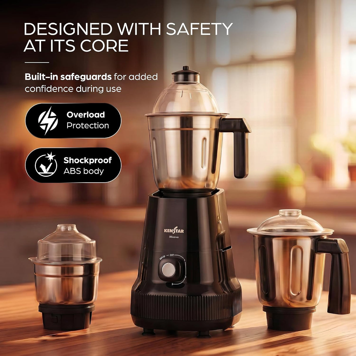 A black and stainless steel electric blender set displayed on a wooden table in a warm kitchen setting, with three jars and marketing text on the left.