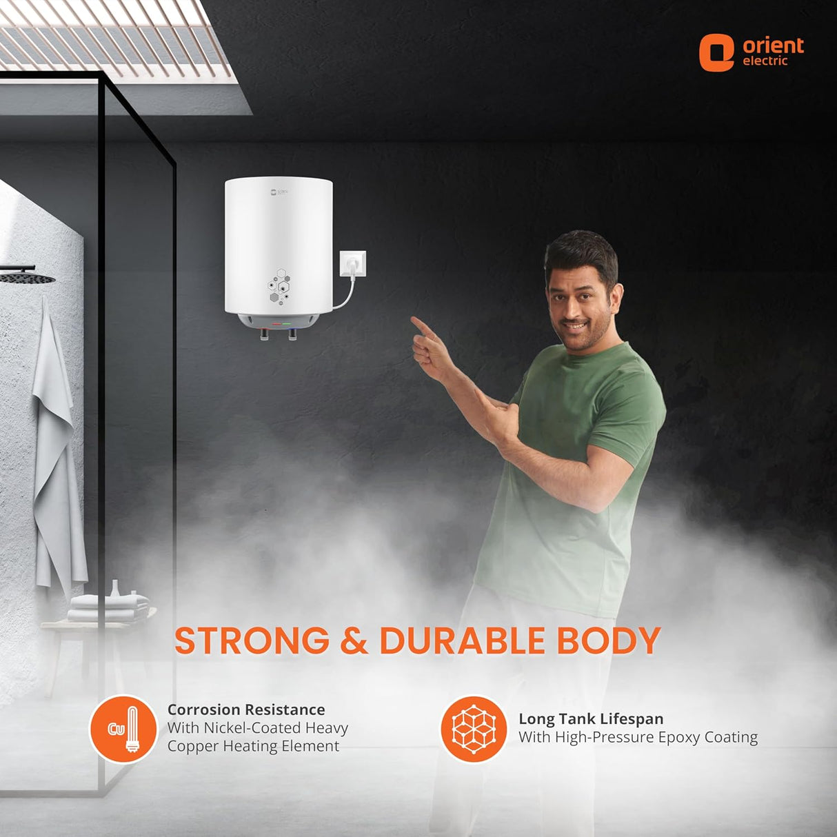 Person pointing at a water heater with 'Orient Electric' branding, featuring text about product strength and durability.