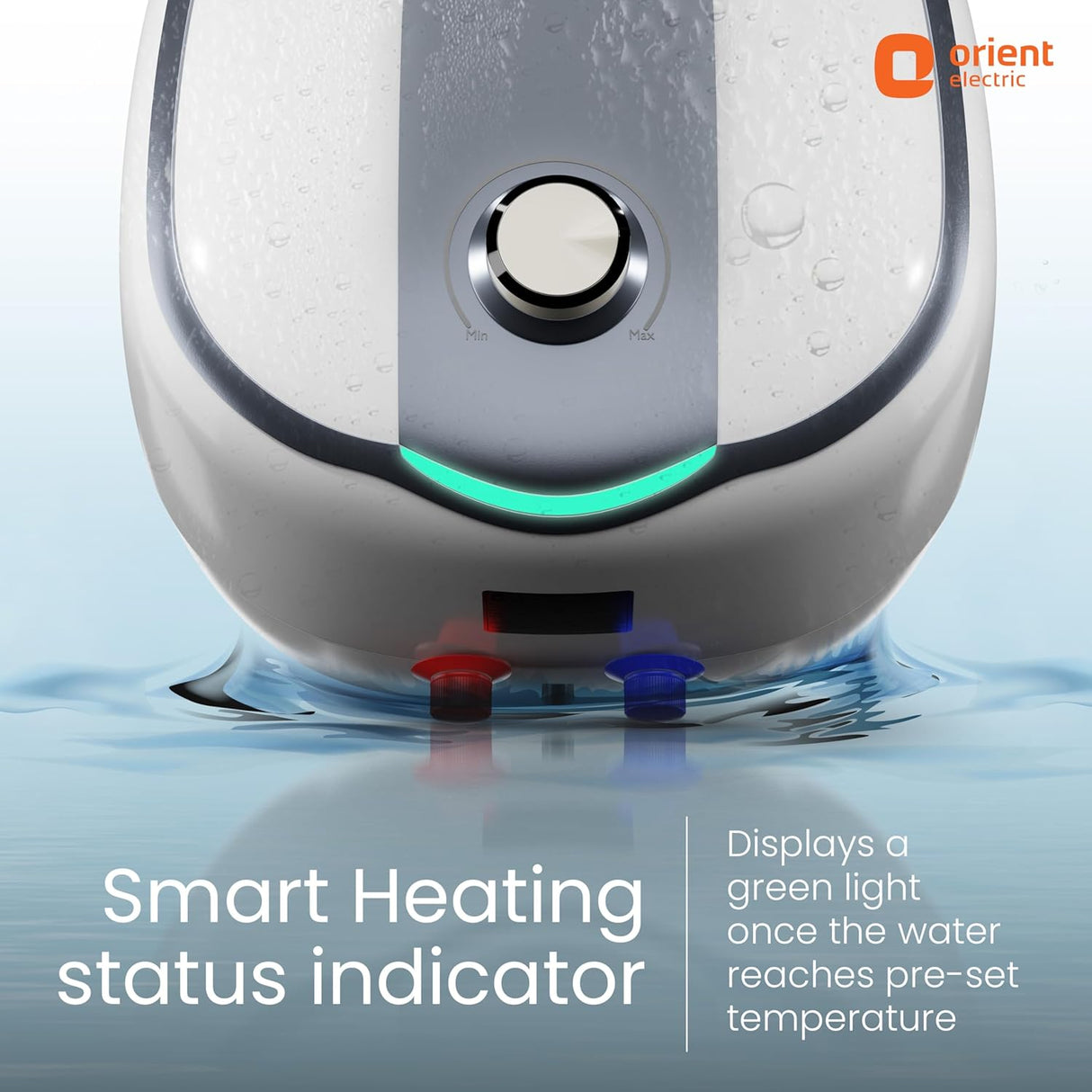 Close-up of a smart water heater or appliance front panel with a central round control, a curved silver-and-white body, a glowing green indicator light, and red/blue port caps at the bottom. Text reads 'Smart Heating status indicator' and 'Displays a green light once the water reaches pre-set temperature,' with the Orient Electric logo in the top right.