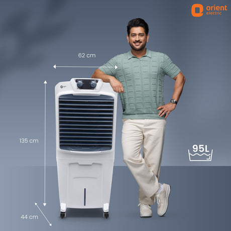 Man standing next to a portable air conditioner with dimensions indicated, featuring Orient Electric logo.